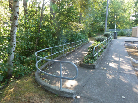 From the parking lot there is a narrow, older ramp that takes one down to the level of the Springwater Corridor Trail